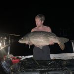 Twan with a carp from the boat